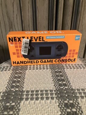 Next Level Apparel Handheld Game Console - Orange Box, Blue Device